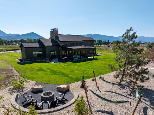 322 S 7900th St E Unit 5, Huntsville, UT 84317 - back of house with a fire pit, a mountain view, a patio, and a lawn