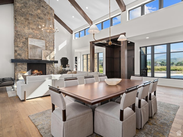 322 S 7900th St E Unit 5, Huntsville, UT 84317 - dining room with high vaulted ceiling, beamed ceiling, hardwood / wood-style floors, and a fireplace