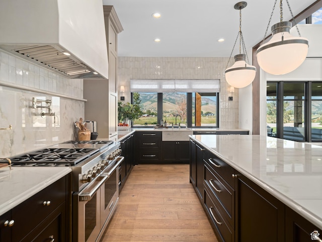 322 S 7900th St E Unit 5, Huntsville, UT 84317 - kitchen featuring custom exhaust hood, range with two ovens, backsplash, light wood-style flooring, and recessed lighting