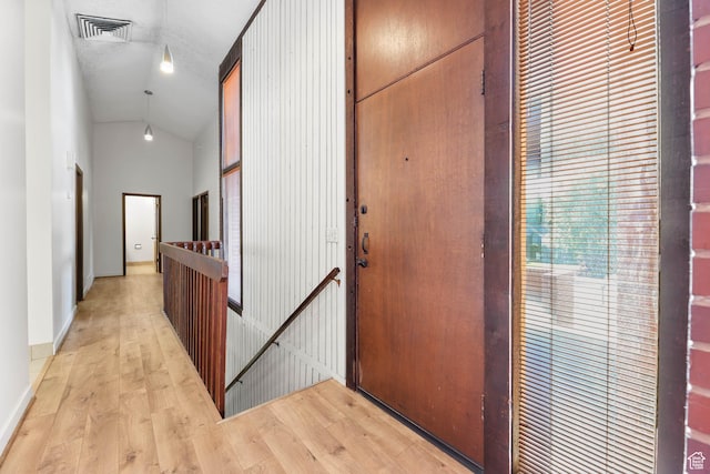 3574 E Kings Cove Way, Cottonwood Heights, UT 84121 - hall with an upstairs landing, vaulted ceiling, and light wood-type flooring