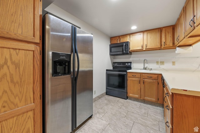 3574 E Kings Cove Way, Cottonwood Heights, UT 84121 - kitchen with appliances with stainless steel finishes, light countertops, recessed lighting, brown cabinetry, and light tile patterned floors