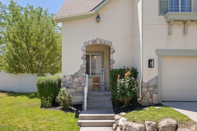 3584 S Autumn Gate Ct, Magna, UT 84044 - view of exterior entry with stone siding, stucco siding, and an attached garage