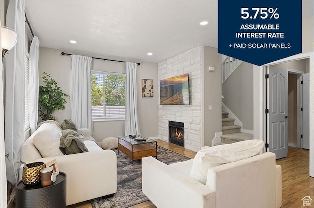 3584 S Autumn Gate Ct, Magna, UT 84044 - living area featuring wood finished floors, stairs, a fireplace, and recessed lighting