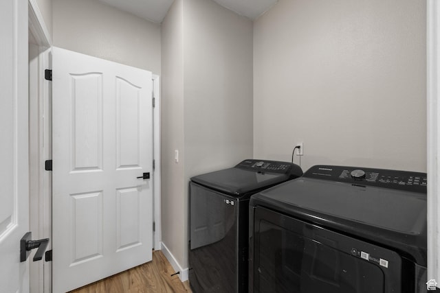 3584 S Autumn Gate Ct, Magna, UT 84044 - laundry area featuring washer and dryer and light wood-type flooring