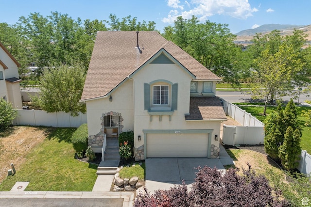 3584 S Autumn Gate Ct, Magna, UT 84044 - view of front of home featuring stucco siding, stone siding, a garage, a shingled roof, and concrete driveway