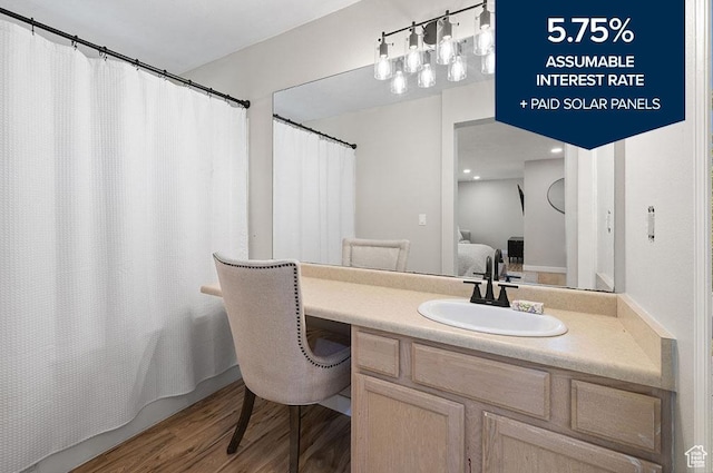 3584 S Autumn Gate Ct, Magna, UT 84044 - bathroom with vanity, wood finished floors, and ensuite bathroom