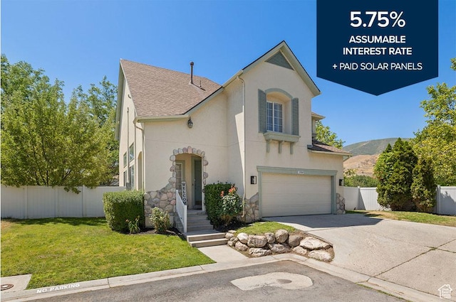 3584 S Autumn Gate Ct, Magna, UT 84044 - view of front of home with a garage, driveway, stone siding, stucco siding, and a mountain view