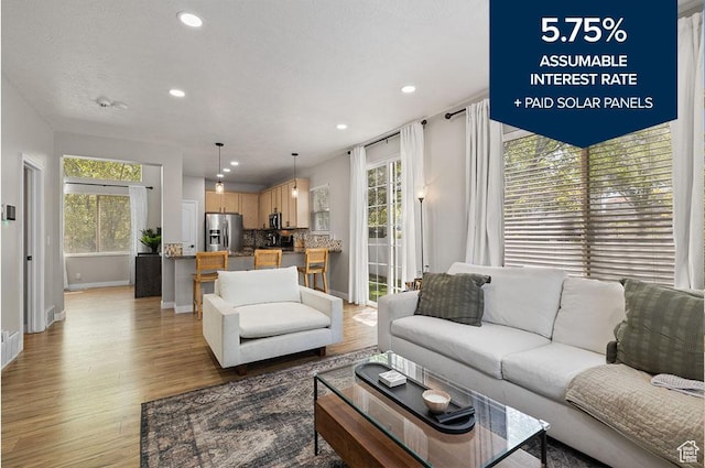 3584 S Autumn Gate Ct, Magna, UT 84044 - living room featuring light wood-type flooring, plenty of natural light, and recessed lighting