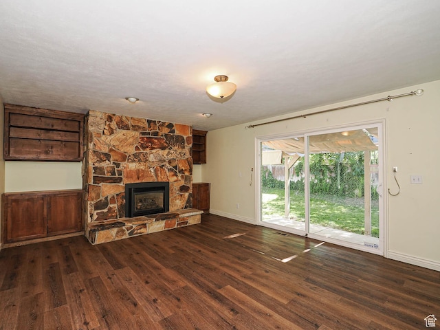 1473 E Millcreek Way, Millcreek, UT 84106 - unfurnished living room featuring wood finished floors and a stone fireplace