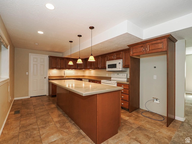 1473 E Millcreek Way, Millcreek, UT 84106 - kitchen with white appliances, a kitchen island, light countertops, recessed lighting, and pendant lighting