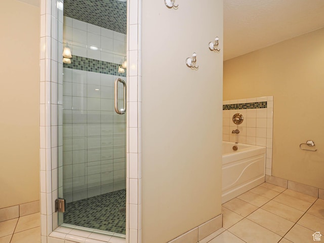 1473 E Millcreek Way, Millcreek, UT 84106 - full bathroom featuring tile patterned flooring, a stall shower, and a garden tub