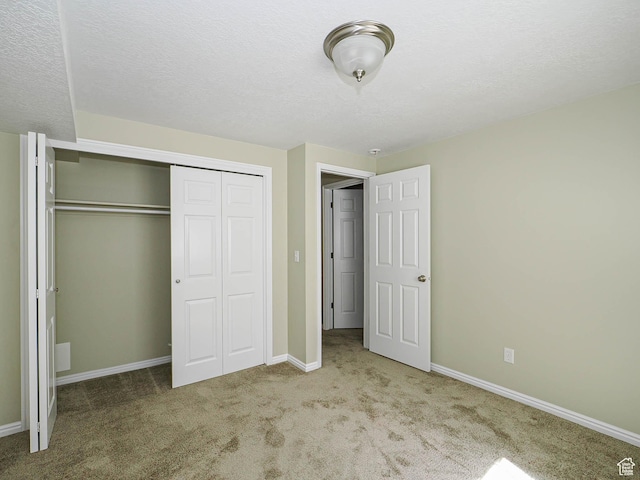1473 E Millcreek Way, Millcreek, UT 84106 - unfurnished bedroom featuring carpet floors, a closet, and a textured ceiling