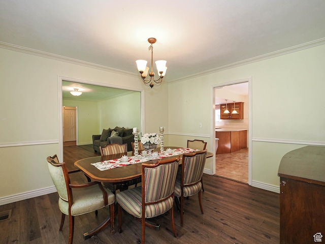 1473 E Millcreek Way, Millcreek, UT 84106 - dining area with a chandelier, dark wood finished floors, and ornamental molding