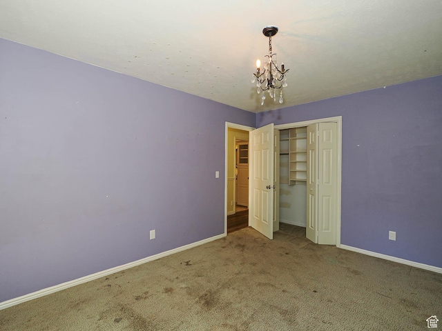 1473 E Millcreek Way, Millcreek, UT 84106 - unfurnished bedroom with a chandelier, carpet flooring, and a closet