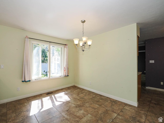 1473 E Millcreek Way, Millcreek, UT 84106 - empty room with a chandelier and stone finish floors