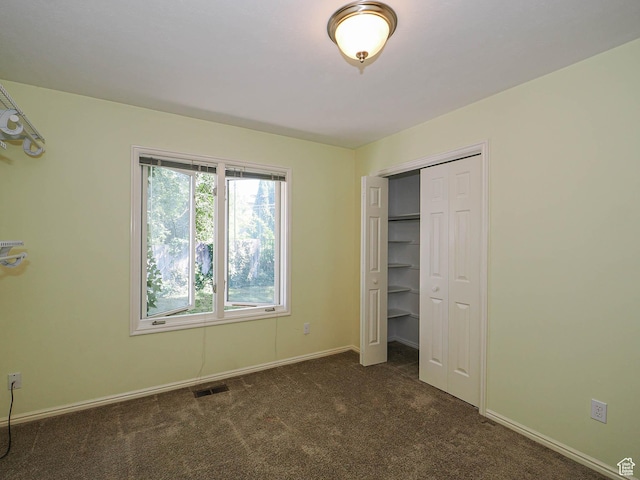 1473 E Millcreek Way, Millcreek, UT 84106 - unfurnished bedroom with dark colored carpet and a closet