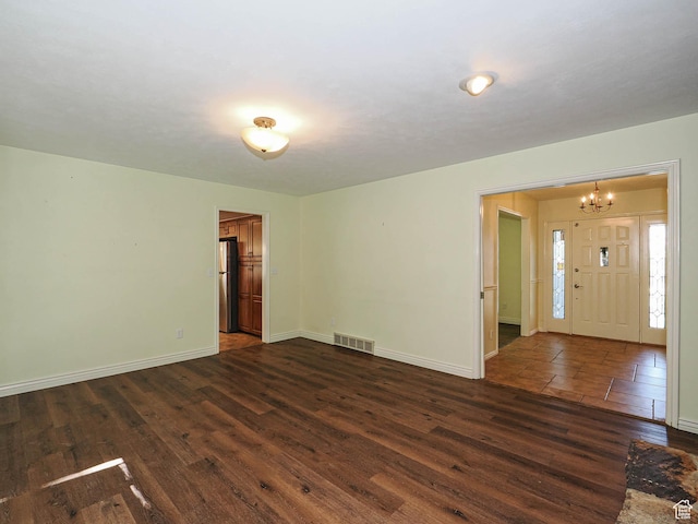 1473 E Millcreek Way, Millcreek, UT 84106 - spare room with a chandelier and dark wood-style floors