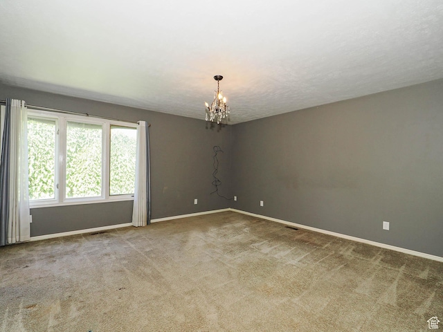 1473 E Millcreek Way, Millcreek, UT 84106 - unfurnished room featuring a chandelier and carpet flooring
