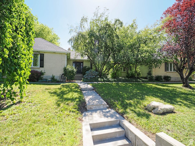 1473 E Millcreek Way, Millcreek, UT 84106 - view of front of house with brick siding and a front yard