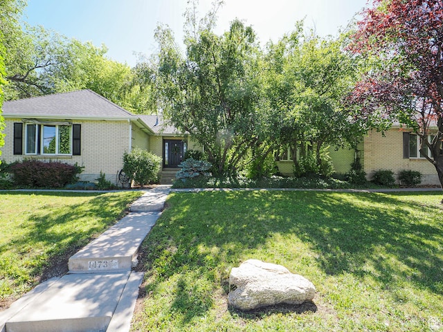 1473 E Millcreek Way, Millcreek, UT 84106 - view of front of home featuring brick siding and a front lawn