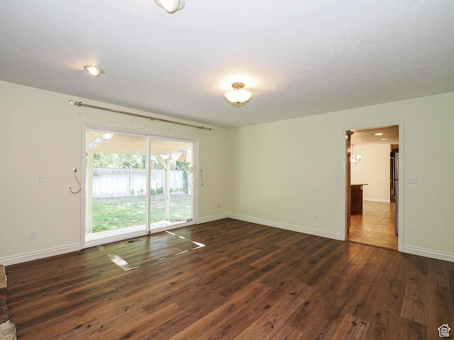 1473 E Millcreek Way, Millcreek, UT 84106 - unfurnished room with dark wood finished floors and baseboards