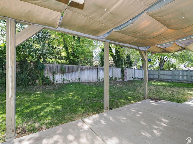 1473 E Millcreek Way, Millcreek, UT 84106 - fenced backyard featuring a patio
