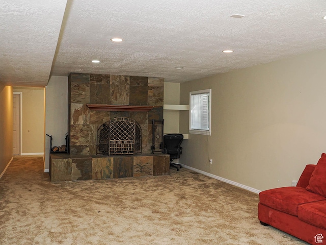 1473 E Millcreek Way, Millcreek, UT 84106 - carpeted living room featuring a textured ceiling, recessed lighting, and a tile fireplace