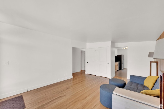 819 E 1100 N, Ogden, UT 84404 - living room featuring light wood-style flooring and baseboards