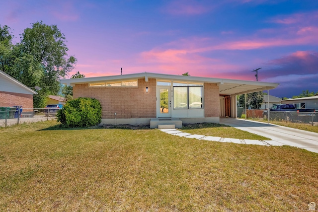 819 E 1100 N, Ogden, UT 84404 - view of front of home featuring a carport, brick siding, concrete driveway, and entry steps