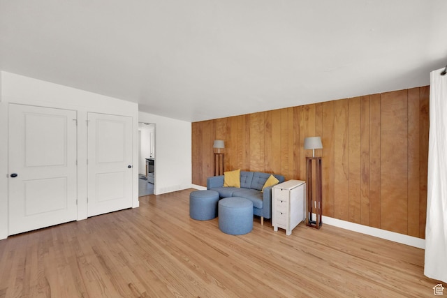 819 E 1100 N, Ogden, UT 84404 - sitting room with light wood-style flooring and wood walls
