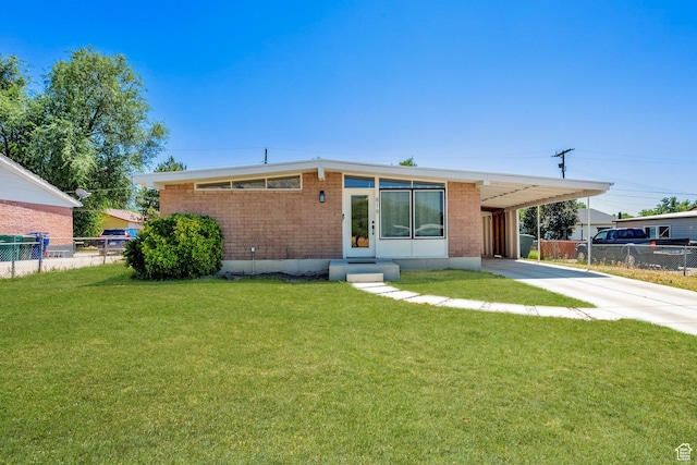 819 E 1100 N, Ogden, UT 84404 - mid-century modern home featuring driveway, an attached carport, entry steps, and brick siding
