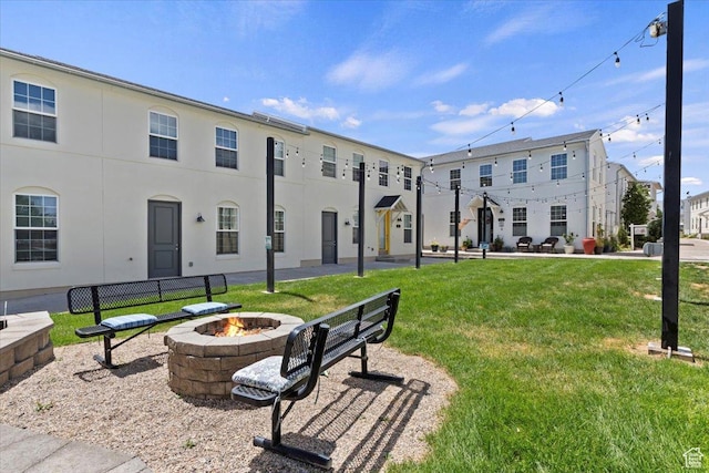 10606 S Redknife Dr, South Jordan, UT 84009 - view of property's community featuring a fire pit and a lawn