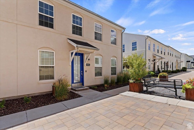 10606 S Redknife Dr, South Jordan, UT 84009 - view of property featuring stucco siding and a residential view