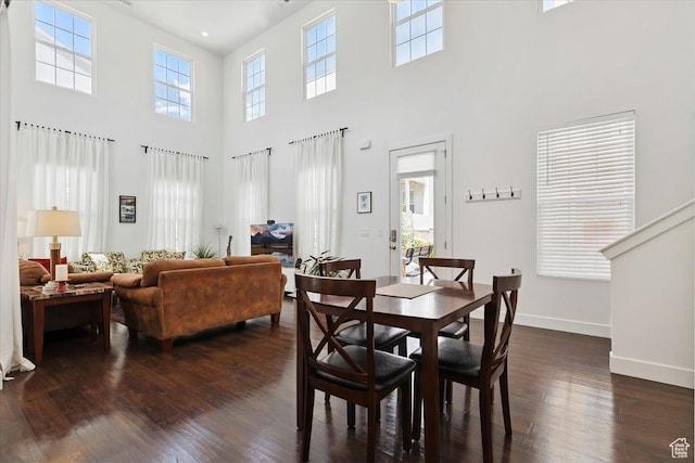 10606 S Redknife Dr, South Jordan, UT 84009 - dining room with a towering ceiling and dark wood finished floors