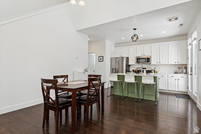 10606 S Redknife Dr, South Jordan, UT 84009 - dining area featuring dark wood-style flooring and recessed lighting