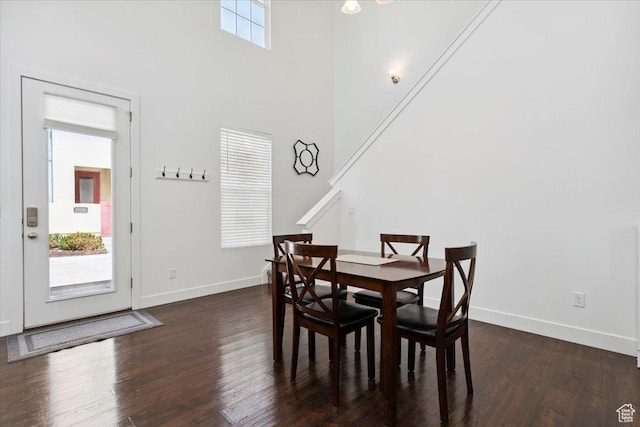 10606 S Redknife Dr, South Jordan, UT 84009 - dining area with dark wood-style flooring and a high ceiling