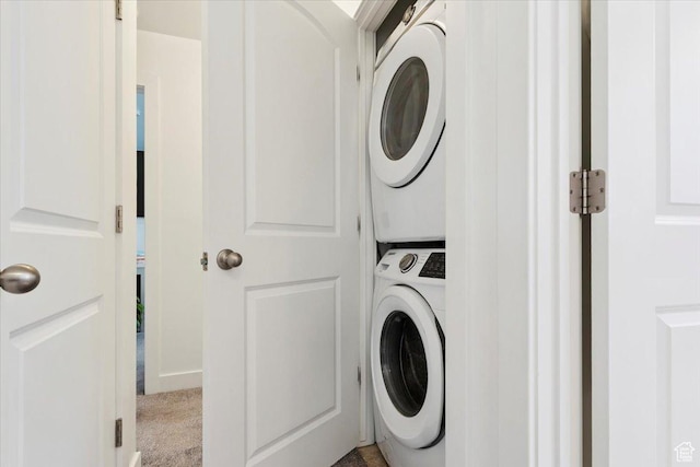 10606 S Redknife Dr, South Jordan, UT 84009 - laundry area with stacked washing machine and dryer and carpet floors