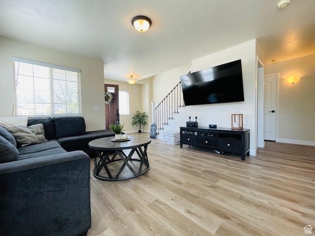 908 W Timpie Rd S, Tooele, UT 84074 - living area featuring light wood finished floors and stairs