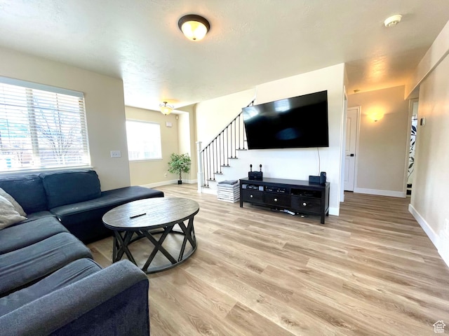 908 W Timpie Rd S, Tooele, UT 84074 - living area featuring stairway and light wood-style floors