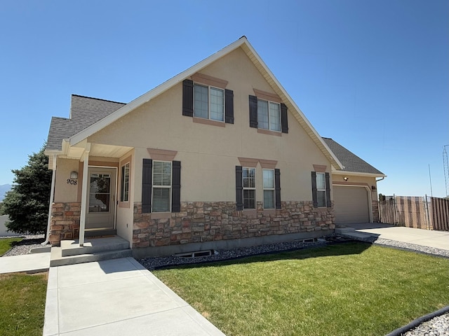 908 W Timpie Rd S, Tooele, UT 84074 - view of front of house with stone siding, concrete driveway, a shingled roof, and an attached garage