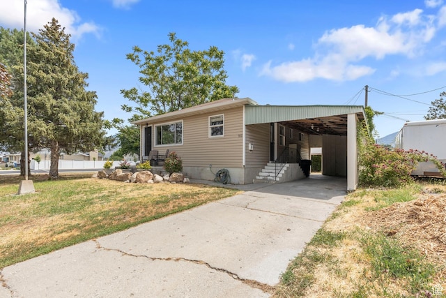 780 N 200 E, Spanish Fork, UT 84660 - view of front facade featuring concrete driveway, a front yard, and an attached carport