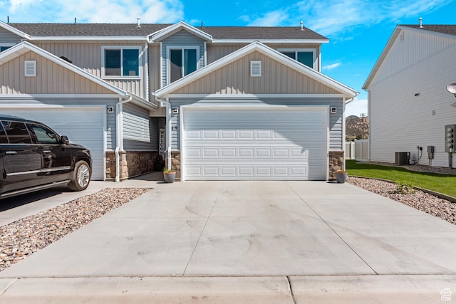 48 E Cedar Ln, Malad City, ID 83252 - craftsman-style home featuring stone siding, driveway, a garage, and board and batten siding