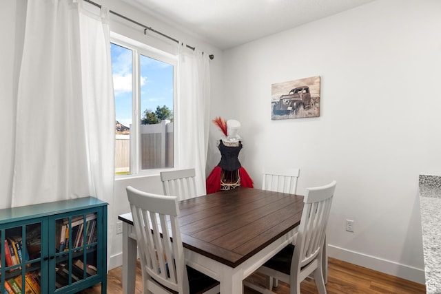 48 E Cedar Ln, Malad City, ID 83252 - dining room featuring healthy amount of natural light and wood finished floors