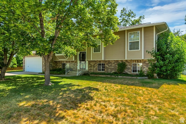 2386 N 725 W, Layton, UT 84041 - raised ranch featuring a front lawn, driveway, brick siding, and a garage