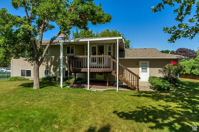 2386 N 725 W, Layton, UT 84041 - rear view of property featuring a wooden deck, a lawn, stairway, and a shingled roof