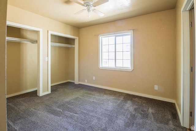 168 S 100 W, Roosevelt, UT 84066 - unfurnished bedroom with multiple closets and dark colored carpet
