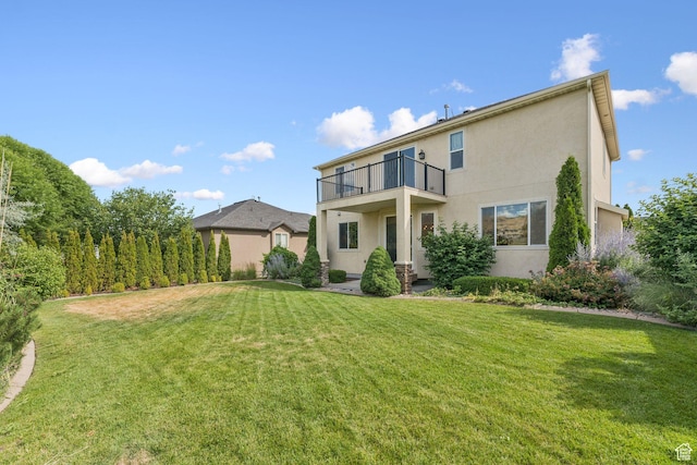 2886 N Desert Forest Ln, Lehi, UT 84043 - rear view of property with a balcony, stucco siding, and a yard