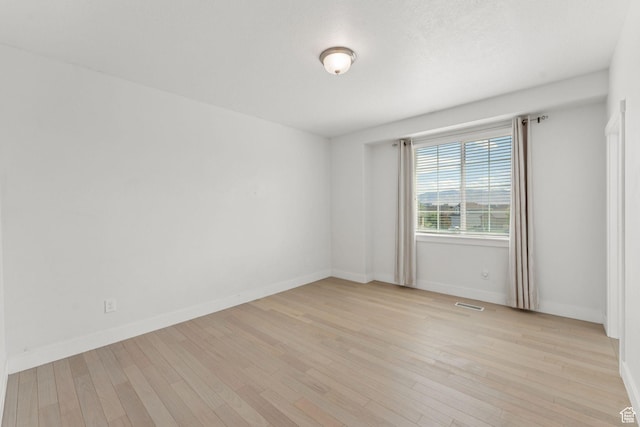 2886 N Desert Forest Ln, Lehi, UT 84043 - empty room featuring light wood-style flooring and baseboards