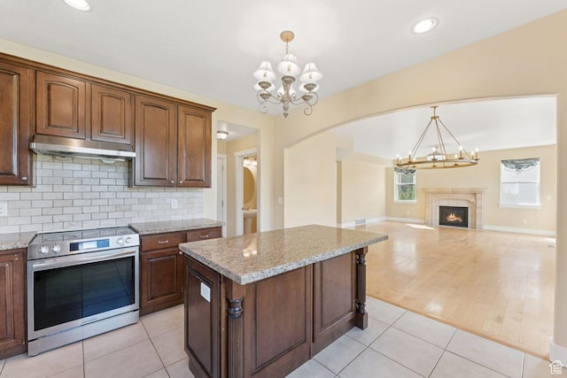 2886 N Desert Forest Ln, Lehi, UT 84043 - kitchen featuring stainless steel electric range oven, a chandelier, under cabinet range hood, backsplash, and recessed lighting