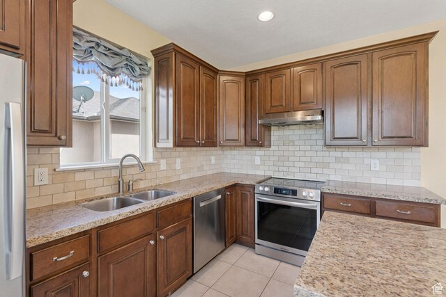 2886 N Desert Forest Ln, Lehi, UT 84043 - kitchen with appliances with stainless steel finishes, under cabinet range hood, light tile patterned floors, tasteful backsplash, and recessed lighting